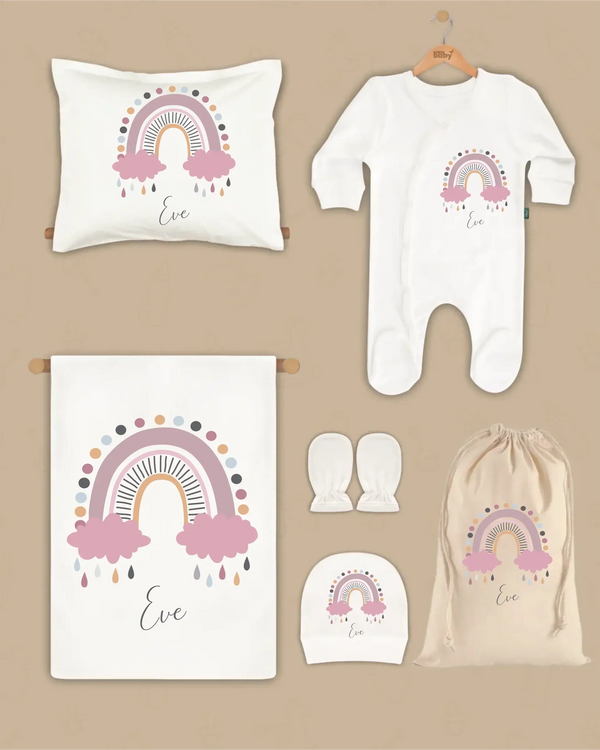 Pastel regenboog newborn cadeauset met kussen, boxpakje, muts en dekentje met naam Eve.