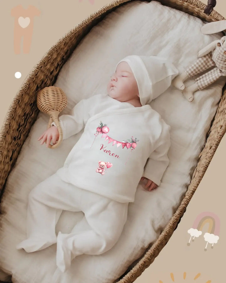 Baby in personalized organic cotton outfit sleeping peacefully in a cozy basket.
