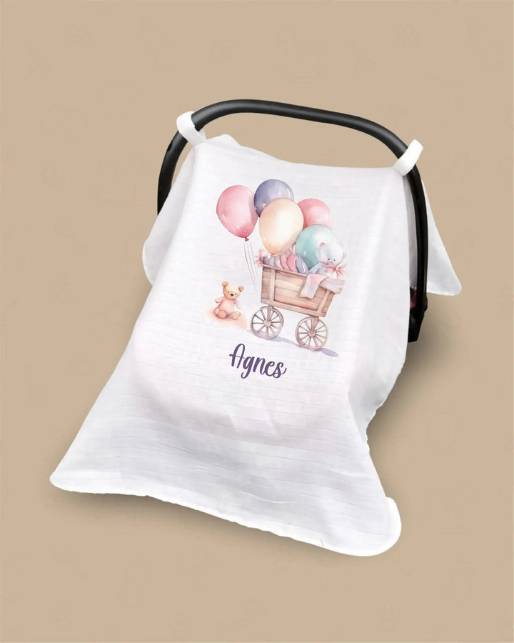 Gepersonaliseerde hydrofiele zonnekap voor autostoel met naam 'Agnes' en schattige ballonnen en teddybeer.