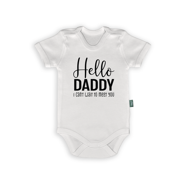 White baby romper with text "Hello Daddy, I can't wait to meet you" for pregnancy announcement.