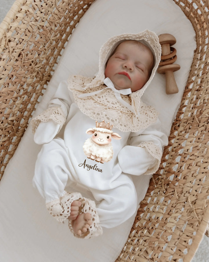 Newborn girl in a 4-piece clothing set featuring a cute lamb design and lace, personalized with the name Angelina.