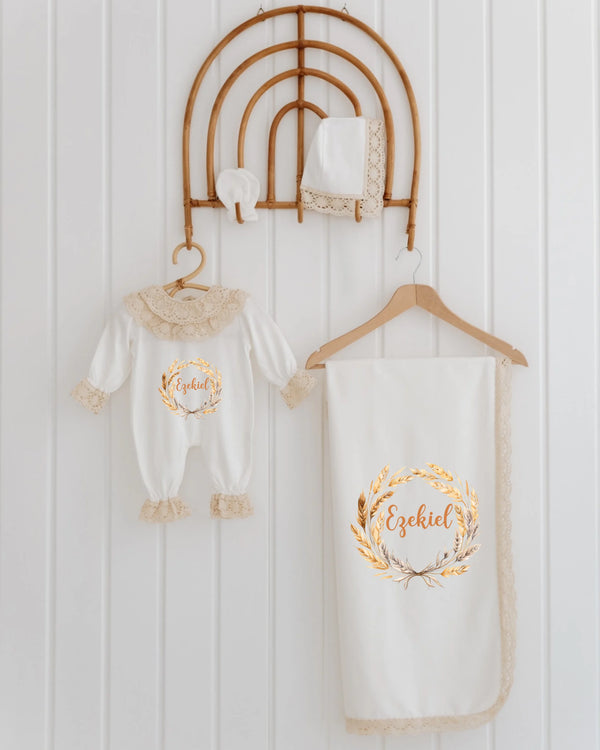 4-piece newborn baby clothing set with lace details and golden illustration, perfect for stylish baby girls.