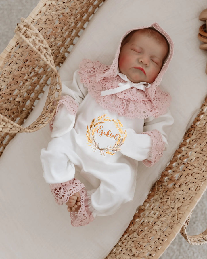 Stylish newborn baby girl outfit with lace details in a woven basket, perfect for 0-3 months.