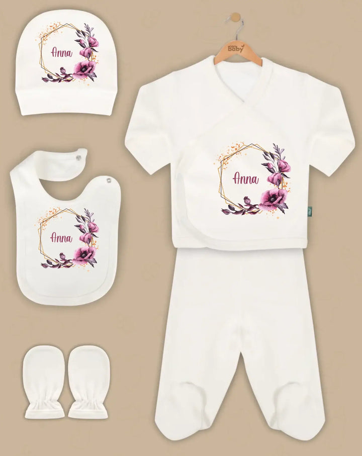 5-piece personalized baby gift set with floral designs, including bib, hat, romper, and booties.